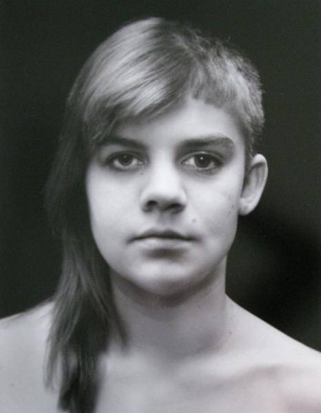 A photograph of the left half of a woman's face, combined with the right half of a man's face.